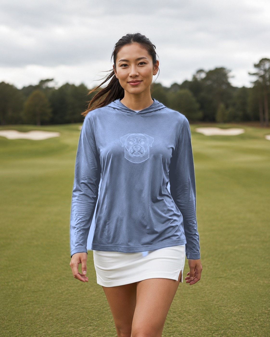 A golfer on the fairway in the DEVEN Georgia Blue hoodie