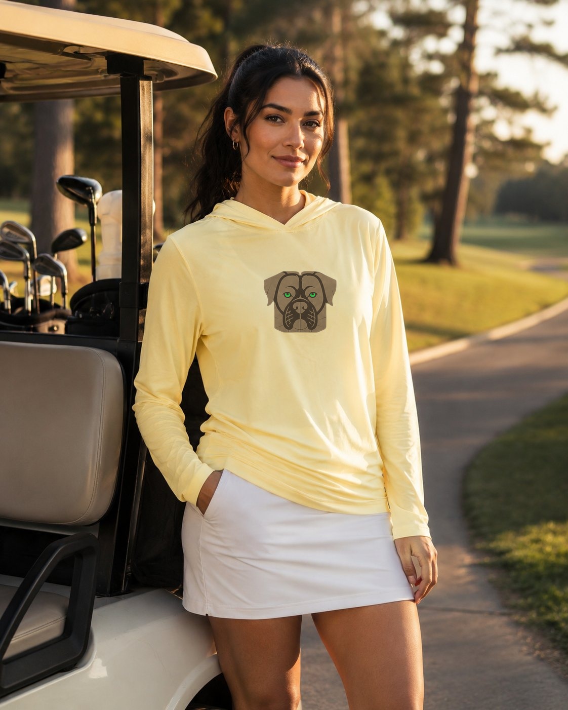 A golfer beside the cart in the DEVEN Peanut Cream hoodie